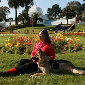 Vicki in a park with her dog.